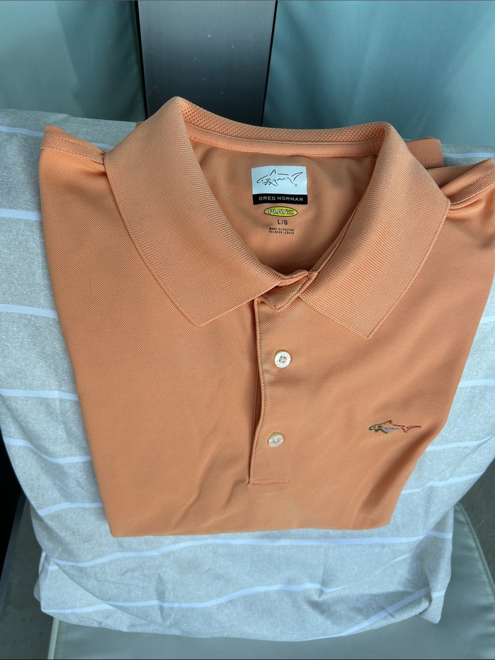 Greg Norman Collection Men's Polo in Peach-Orange